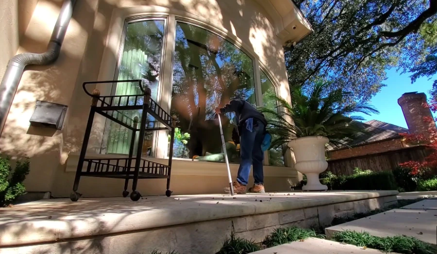 Technician cleaning window tracks in San Clemente